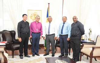 President Ramkalawan meets the three Anglican clergy members who received doctorates