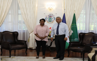 President Wavel Ramkalawan meets Ms. Valentin following her accomplishment in the hotel industry